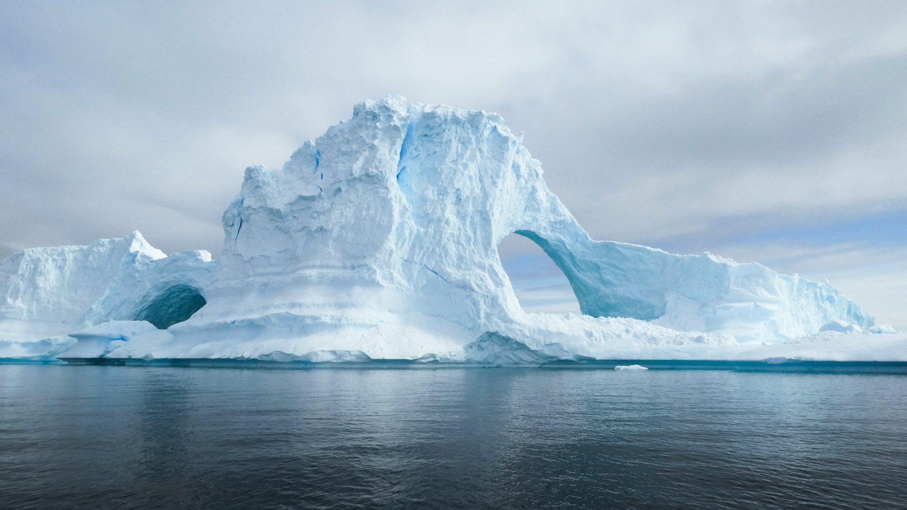 An iceberg with a natural arch off Portal Point on the Antarctic Peninsula